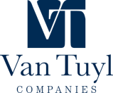 Logo of Van Tuyl Companies with a stylized "vt" in blue, showcasing "What We Do".